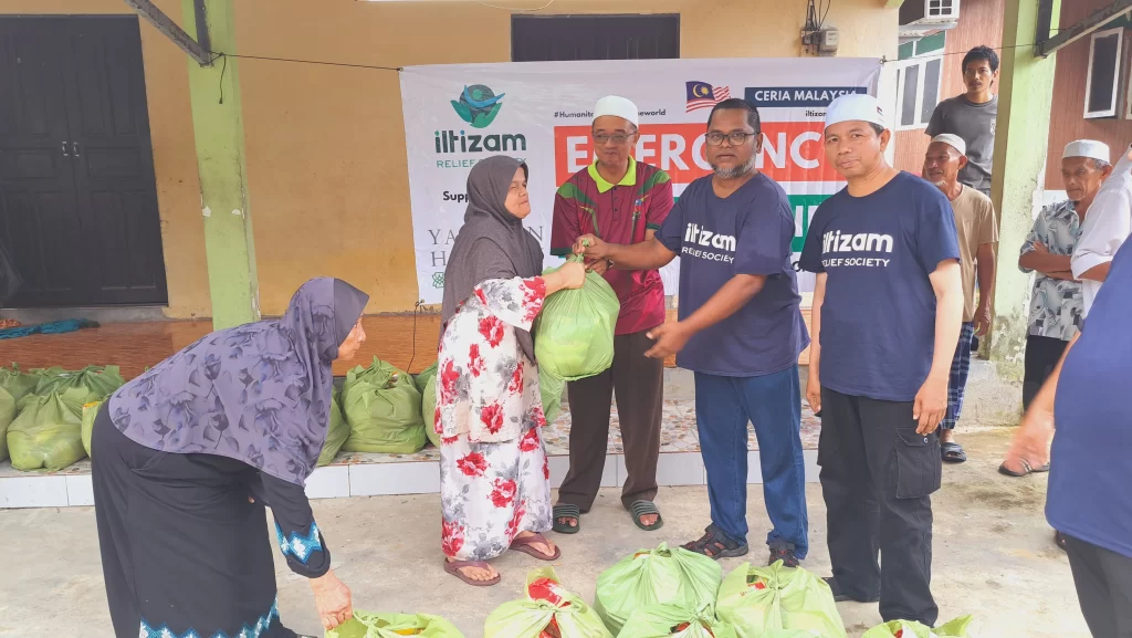 Distribution of essential food aid, emphasizing the carefully assembled food baskets that served as a lifeline for the affected families.